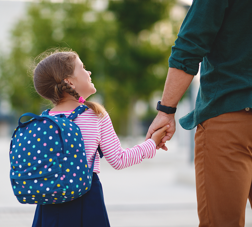 dad walking daughter into school