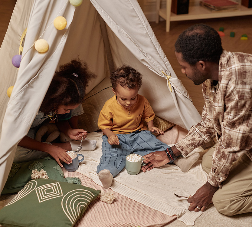 dad and kids playing with hot chocolate